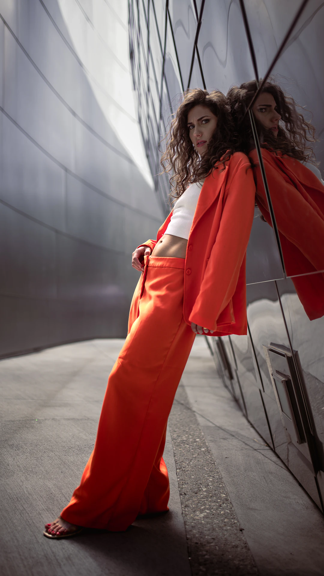 a woman in a red dress holding an umbrella